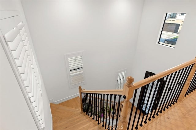 10413 Saint Anna Pl, Fountain Valley, CA 92708 - stairway with wood finished floors and a towering ceiling