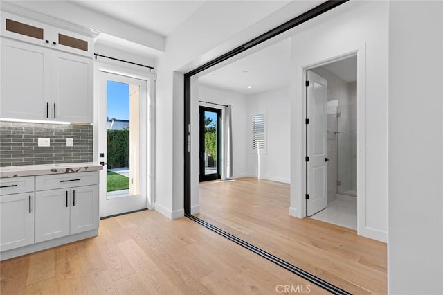 10413 Saint Anna Pl, Fountain Valley, CA 92708 - foyer with light wood-type flooring and baseboards