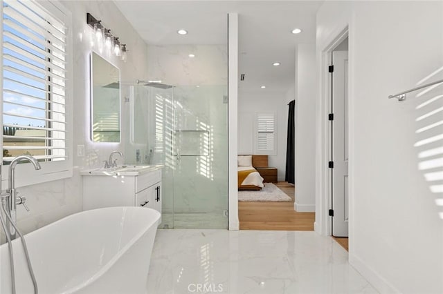 10413 Saint Anna Pl, Fountain Valley, CA 92708 - bathroom featuring a marble finish shower, a freestanding bath, recessed lighting, vanity, and marble tiled flooring