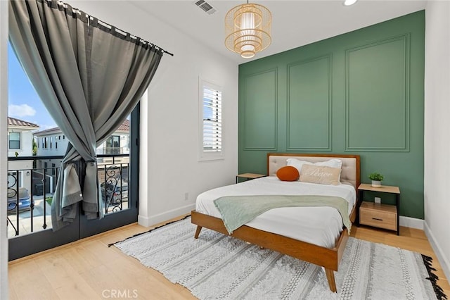 10413 Saint Anna Pl, Fountain Valley, CA 92708 - bedroom with wood finished floors, recessed lighting, a chandelier, and access to outside