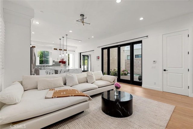 10413 Saint Anna Pl, Fountain Valley, CA 92708 - living room featuring light wood finished floors and recessed lighting