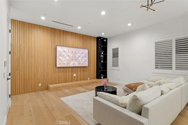 10413 Saint Anna Pl, Fountain Valley, CA 92708 - living area with wood finished floors, recessed lighting, a chandelier, and wooden walls