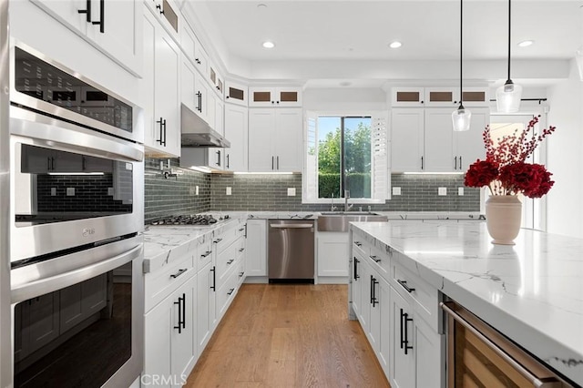 10413 Saint Anna Pl, Fountain Valley, CA 92708 - kitchen featuring stainless steel appliances, beverage cooler, light wood-style flooring, white cabinetry, and glass insert cabinets