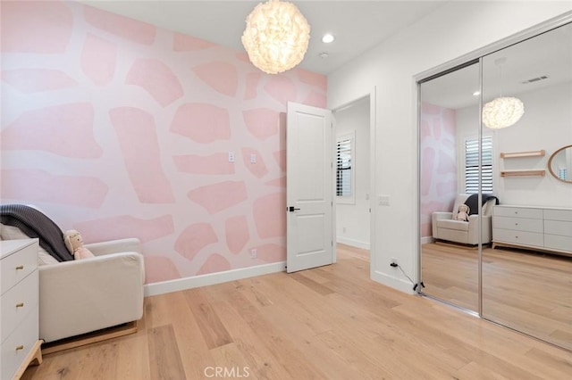 10413 Saint Anna Pl, Fountain Valley, CA 92708 - bedroom with wood finished floors, a chandelier, a closet, recessed lighting, and wallpapered walls