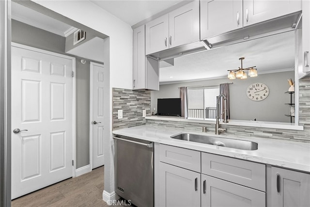 5230 Zelzah Ave Unit 3, Encino, CA 91316 - kitchen featuring dishwasher, wood finished floors, ornamental molding, decorative backsplash, and light stone counters