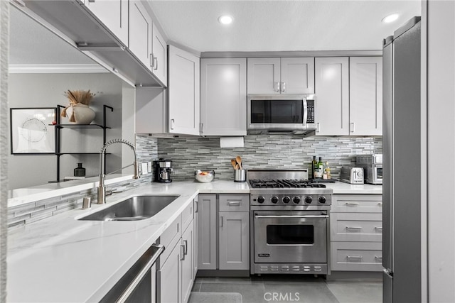5230 Zelzah Ave Unit 3, Encino, CA 91316 - kitchen with appliances with stainless steel finishes, tasteful backsplash, gray cabinetry, light stone countertops, and recessed lighting