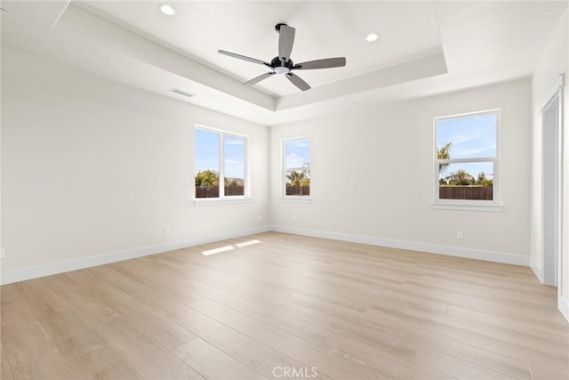 5035 San Juanico Dr, Chico, CA 95973 - empty room featuring a raised ceiling, light wood-style floors, ceiling fan, and recessed lighting