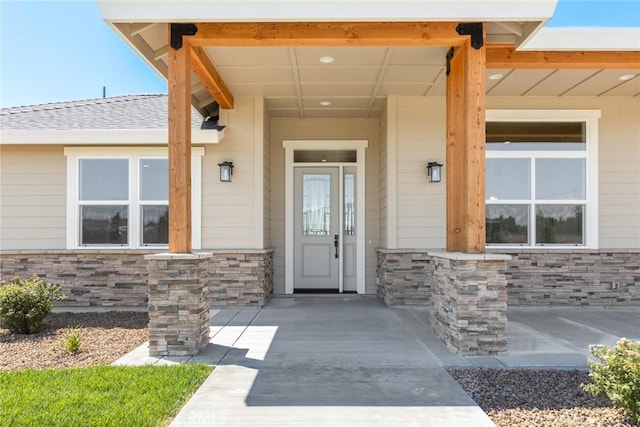 5035 San Juanico Dr, Chico, CA 95973 - view of exterior entry featuring stone siding and a porch