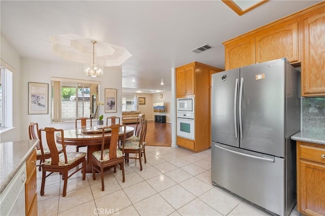 5939 N Vista St, San Gabriel, CA 91775 - dining area featuring a chandelier and light tile patterned flooring