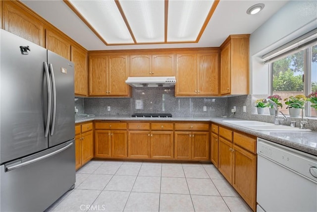 5939 N Vista St, San Gabriel, CA 91775 - kitchen with freestanding refrigerator, dishwasher, under cabinet range hood, brown cabinetry, and gas stovetop