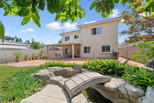5939 N Vista St, San Gabriel, CA 91775 - rear view of house with stucco siding, a fenced backyard, and a patio