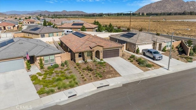 29045 Silver Stirrup Way, Winchester, CA 92596 - view of front of home featuring driveway, an attached garage, a tile roof, a mountain view, and a residential view