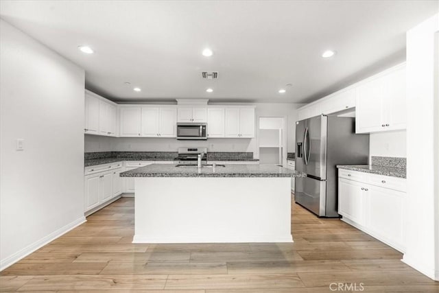 29045 Silver Stirrup Way, Winchester, CA 92596 - kitchen featuring appliances with stainless steel finishes, white cabinets, recessed lighting, and light wood-style flooring