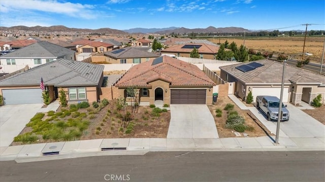 29045 Silver Stirrup Way, Winchester, CA 92596 - view of front facade featuring concrete driveway, a tile roof, a residential view, stucco siding, and a mountain view