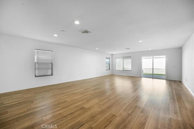 29045 Silver Stirrup Way, Winchester, CA 92596 - empty room with light wood finished floors and recessed lighting