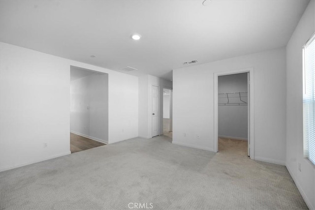 29045 Silver Stirrup Way, Winchester, CA 92596 - unfurnished bedroom featuring carpet, a spacious closet, a closet, and recessed lighting