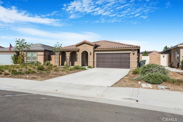 29045 Silver Stirrup Way, Winchester, CA 92596 - mediterranean / spanish house featuring stucco siding, a garage, concrete driveway, and a tiled roof