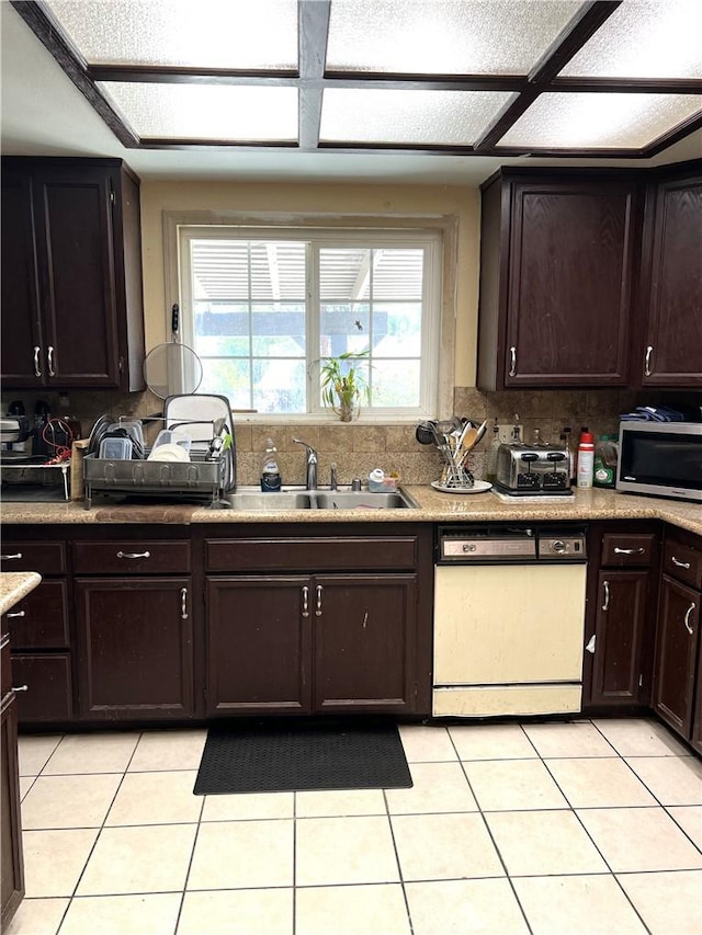 1061 N Perris Blvd, Perris, CA 92571 - kitchen featuring white dishwasher, stainless steel microwave, tasteful backsplash, and light tile patterned floors