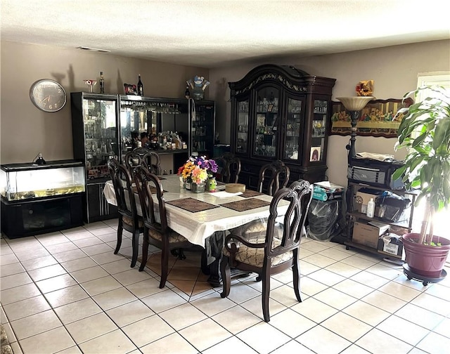 1061 N Perris Blvd, Perris, CA 92571 - dining room with light tile patterned flooring and a textured ceiling