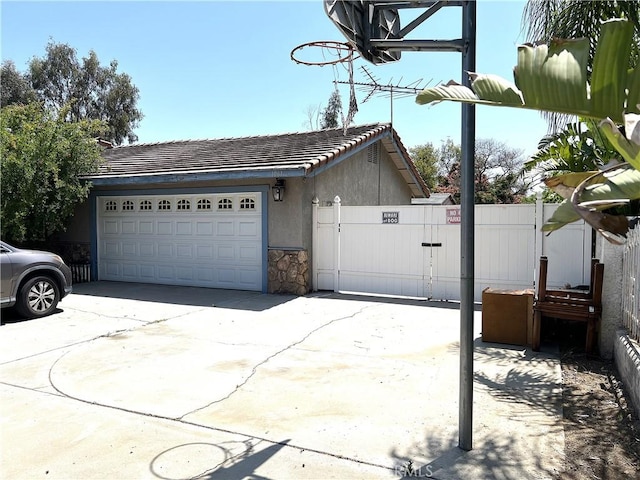 1061 N Perris Blvd, Perris, CA 92571 - garage with driveway and a gate