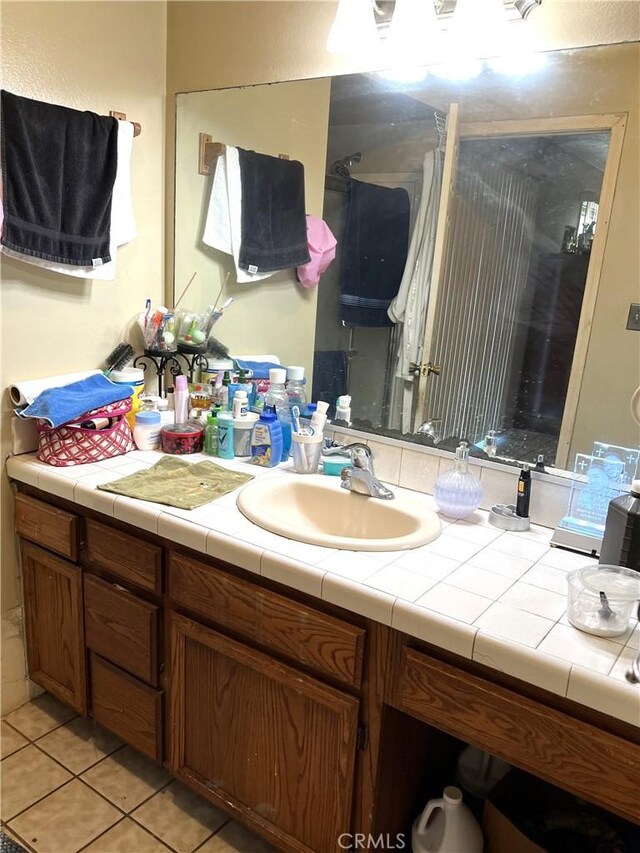 1061 N Perris Blvd, Perris, CA 92571 - bathroom with vanity, a stall shower, and tile patterned floors