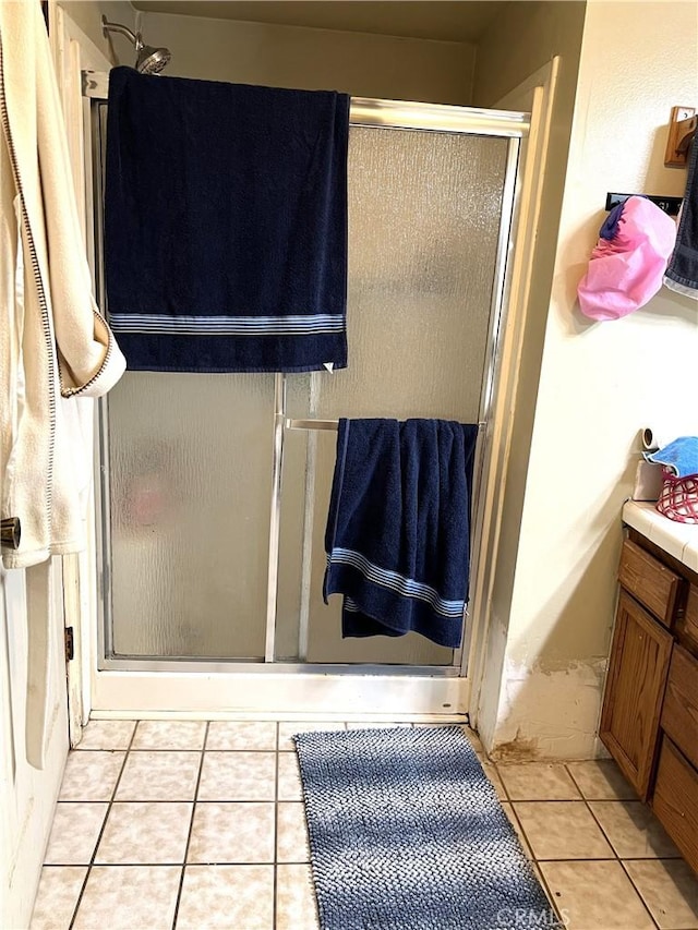 1061 N Perris Blvd, Perris, CA 92571 - full bath featuring a stall shower, tile patterned flooring, and vanity