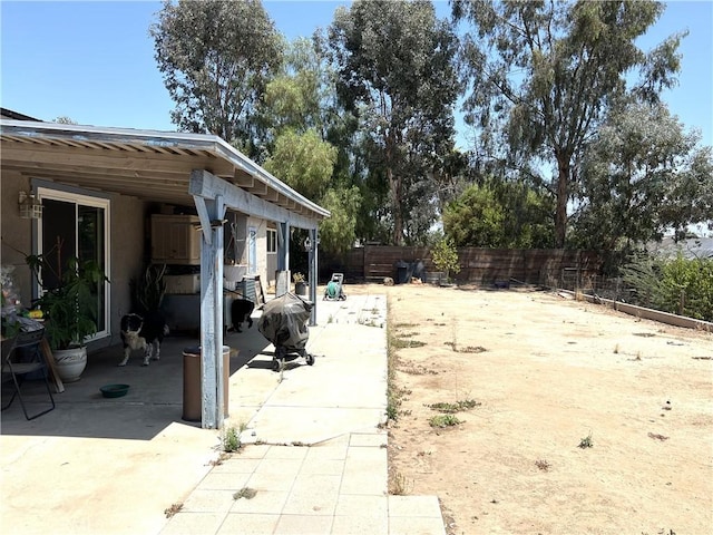 1061 N Perris Blvd, Perris, CA 92571 - fenced backyard featuring a patio area