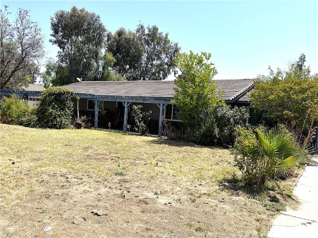 1061 N Perris Blvd, Perris, CA 92571 - ranch-style home featuring a front lawn and a tiled roof