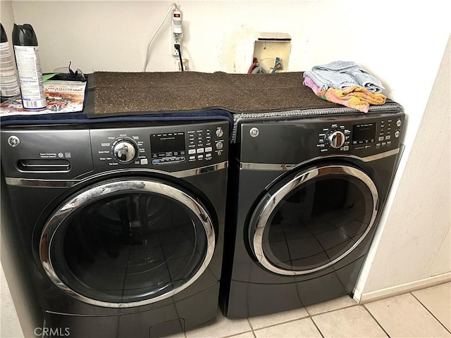 1061 N Perris Blvd, Perris, CA 92571 - washroom featuring independent washer and dryer and tile patterned floors