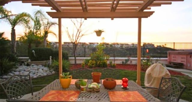 45211 Tioga St, Temecula, CA 92592 - patio terrace at dusk featuring outdoor dining area and a pergola