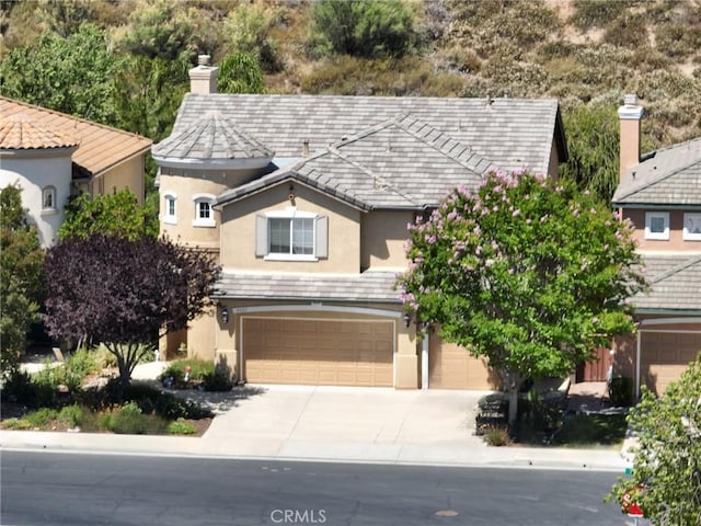 45211 Tioga St, Temecula, CA 92592 - view of front of house featuring stucco siding, a garage, and concrete driveway
