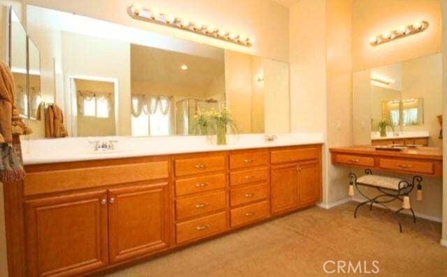 45211 Tioga St, Temecula, CA 92592 - full bath featuring double vanity and a shower with shower door