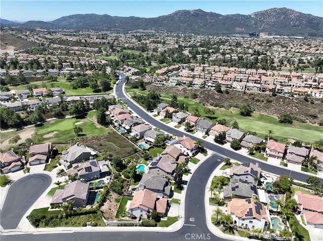 45211 Tioga St, Temecula, CA 92592 - aerial overview of property's location with a mountainous background, nearby suburban area, and a local golf course