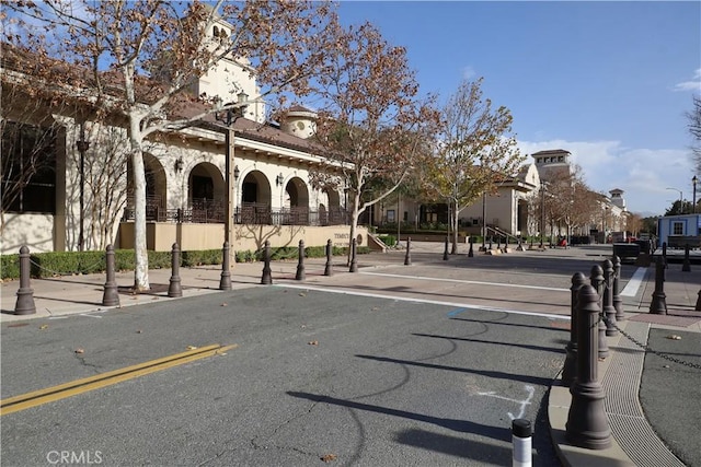45211 Tioga St, Temecula, CA 92592 - view of asphalt street featuring street lights, sidewalks, and curbs