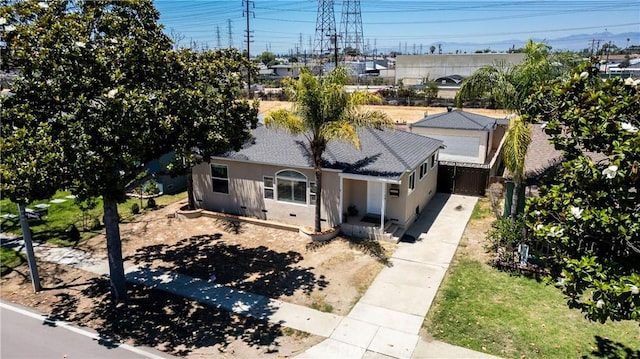 4425 Ashworth St, Lakewood, CA 90712 - view of front of property with a shingled roof and stucco siding