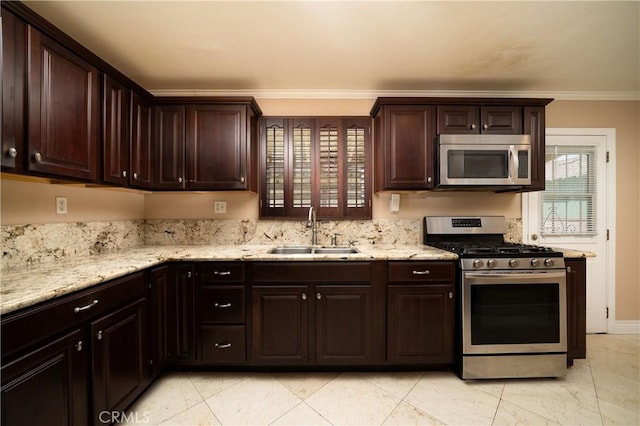 4425 Ashworth St, Lakewood, CA 90712 - kitchen with stainless steel appliances, crown molding, dark brown cabinetry, and light stone countertops
