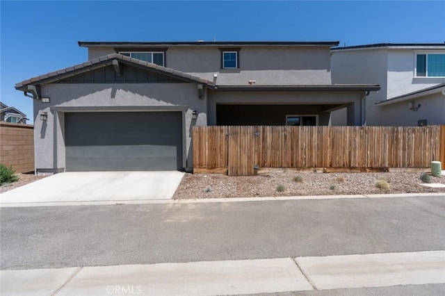 253 Peters Ln S, Madera, CA 93636 - view of front of house featuring stucco siding, concrete driveway, and a garage
