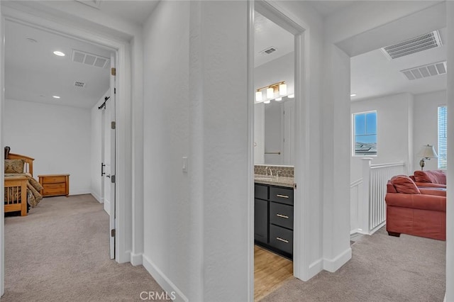 253 Peters Ln S, Madera, CA 93636 - hallway featuring light colored carpet and recessed lighting