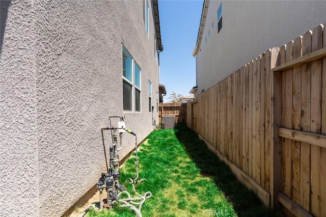 253 Peters Ln S, Madera, CA 93636 - view of property exterior featuring stucco siding and a fenced backyard
