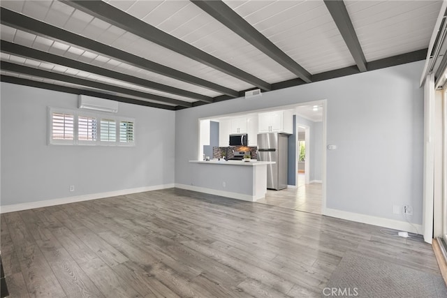 11142 Bertha Pl, Cerritos, CA 90703 - unfurnished living room with beam ceiling, an AC wall unit, and wood finished floors