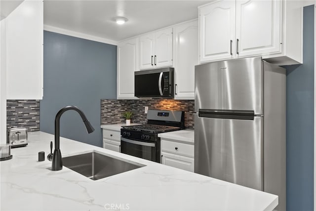 11142 Bertha Pl, Cerritos, CA 90703 - kitchen featuring stainless steel appliances, tasteful backsplash, white cabinetry, and light stone countertops