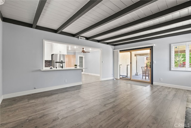 11142 Bertha Pl, Cerritos, CA 90703 - unfurnished living room featuring wood finished floors, ceiling fan, and a wood ceiling with exposed beams