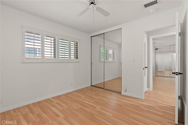 11142 Bertha Pl, Cerritos, CA 90703 - unfurnished bedroom featuring ornamental molding, light wood-style flooring, a closet, and a ceiling fan