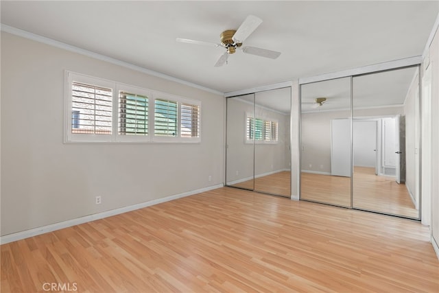 11142 Bertha Pl, Cerritos, CA 90703 - unfurnished bedroom featuring ornamental molding, multiple closets, wood finished floors, and a ceiling fan