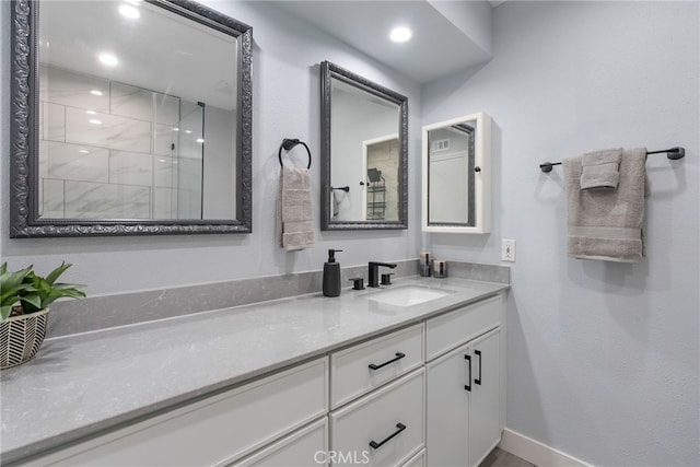 11142 Bertha Pl, Cerritos, CA 90703 - bathroom with vanity, tiled shower, and recessed lighting