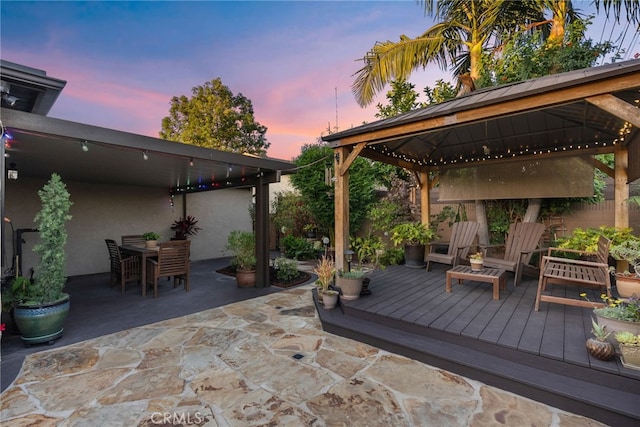 11142 Bertha Pl, Cerritos, CA 90703 - patio terrace at dusk with a gazebo, a patio area, and outdoor dining space
