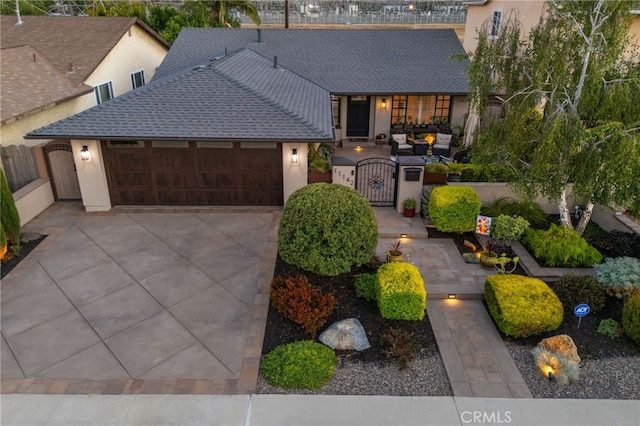 11142 Bertha Pl, Cerritos, CA 90703 - view of front facade with a gate, an attached garage, stucco siding, and driveway