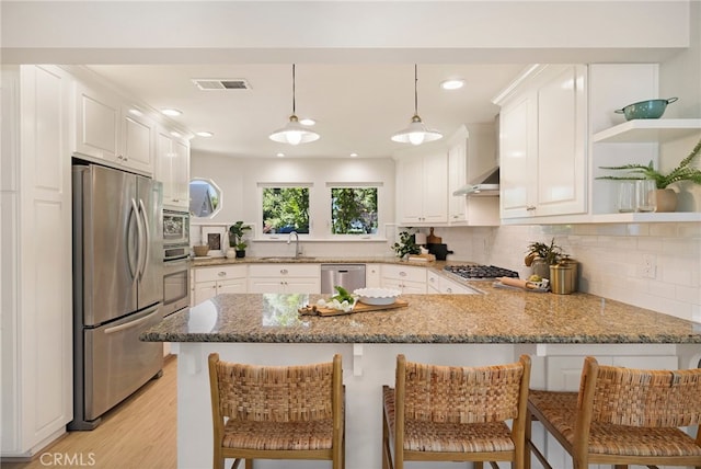 812 Collindale Ct, Chico, CA 95926 - kitchen featuring stainless steel appliances, a peninsula, open shelves, light stone counters, and white cabinets