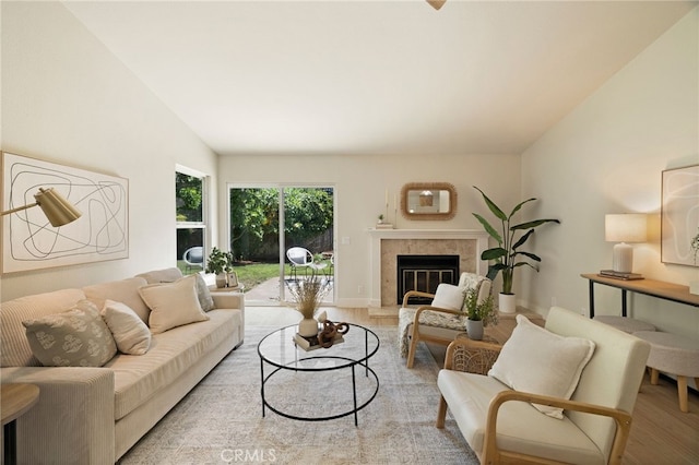 812 Collindale Ct, Chico, CA 95926 - living room featuring wood finished floors, vaulted ceiling, and a tiled fireplace