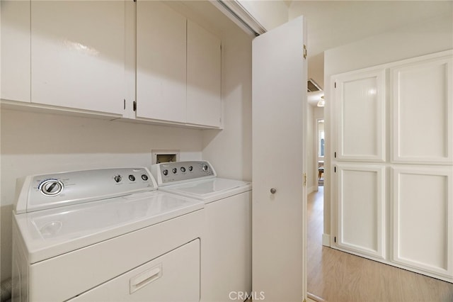 812 Collindale Ct, Chico, CA 95926 - laundry room with cabinet space, washing machine and clothes dryer, and light wood-style flooring